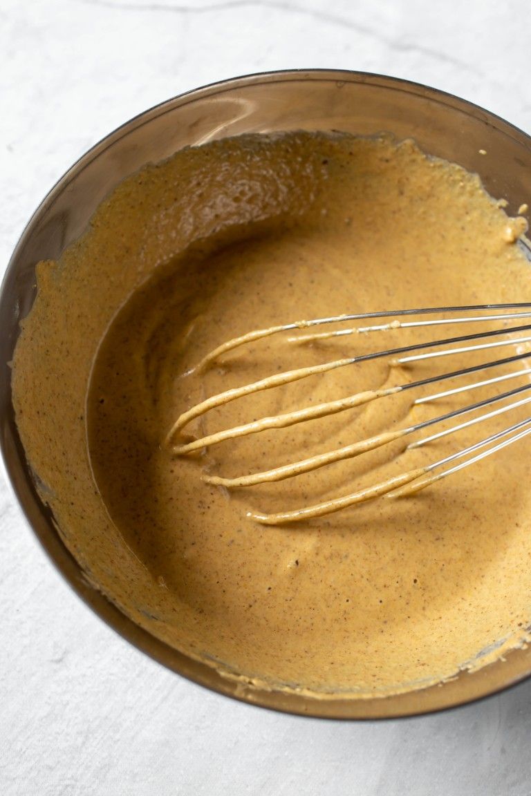 wet pumpkin waffle batter in silver bowl