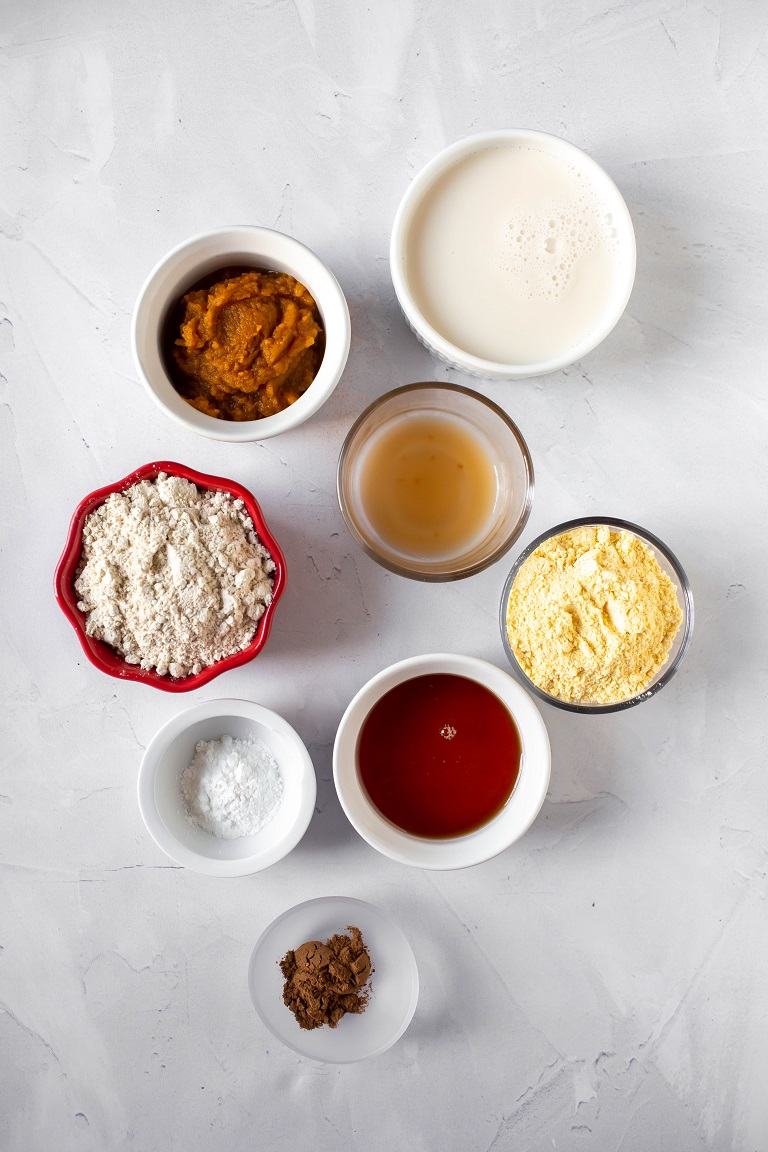 ingredients in individual small bowls for pumpkin cornbread