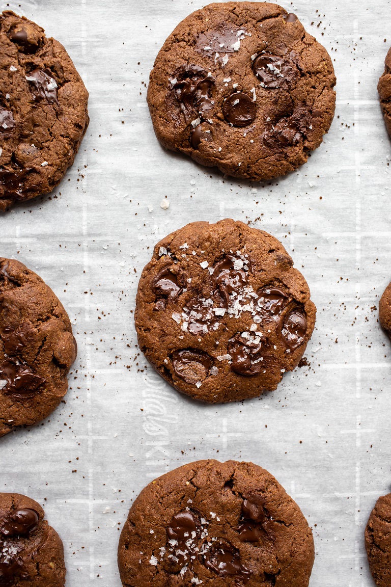 baked vegan chocolate espresso cookies on pan with sea salt on top