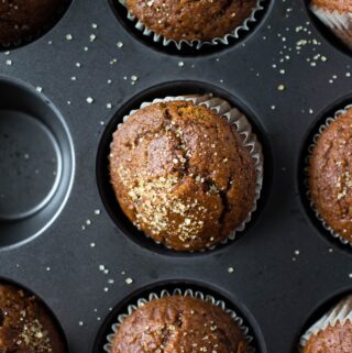 muffin pan of baked gingerbread muffins